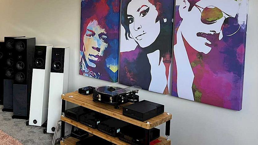 Cyrus listening room with picture of freddie mercury, jimi hendrx and freddie mercury