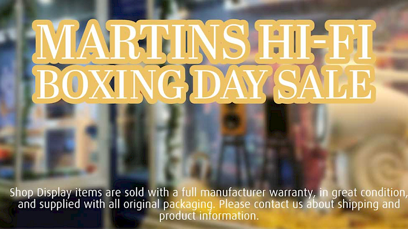 front window of Martins Hi-fi with boxing day sale written over the window in white and gold